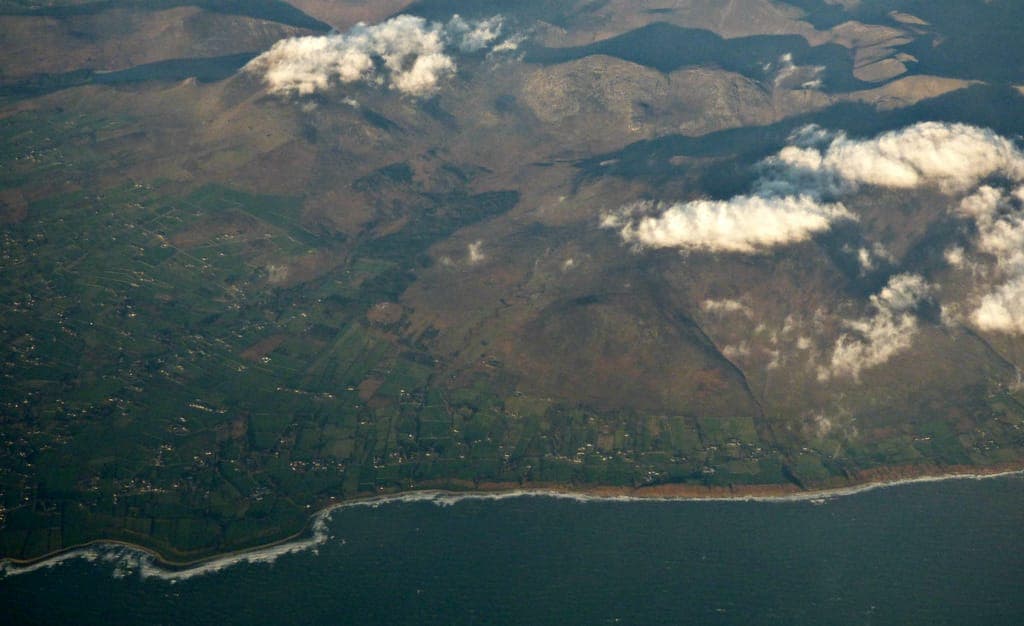 Aerial view of the dramatic Mourne coastline where mountains meet the sea